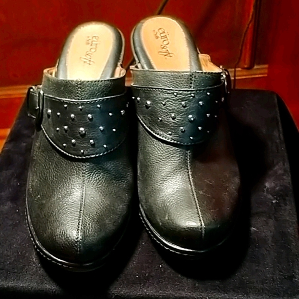 Black clogs..with silver buckle 10M